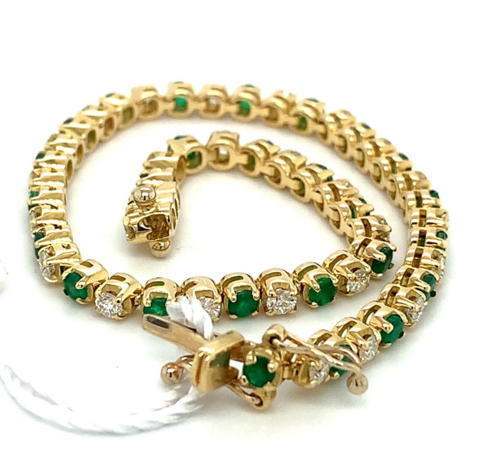 3.34ct round brilliant cut diamond & emerald tennis bracelet 18kt yellow gold, G/H colour, SI clarity