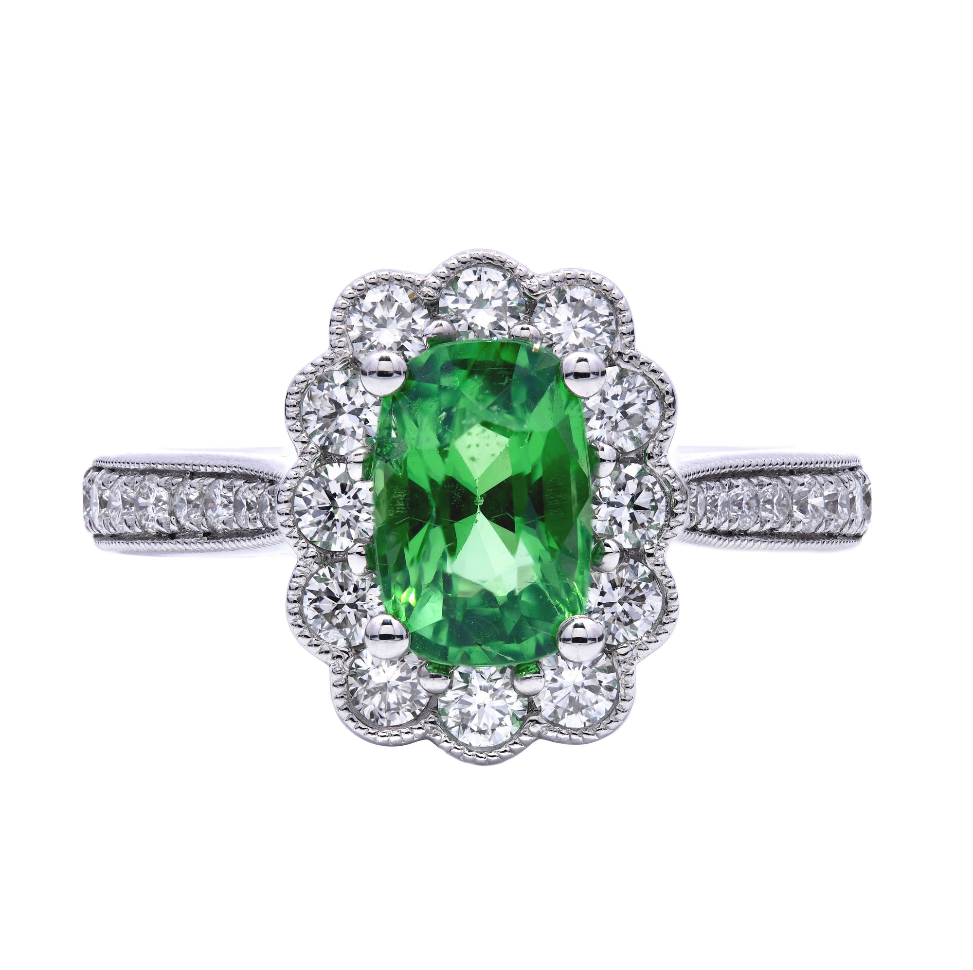 1.75ct oval cut tsavorite & diamond engagement ring set in a platinum halo