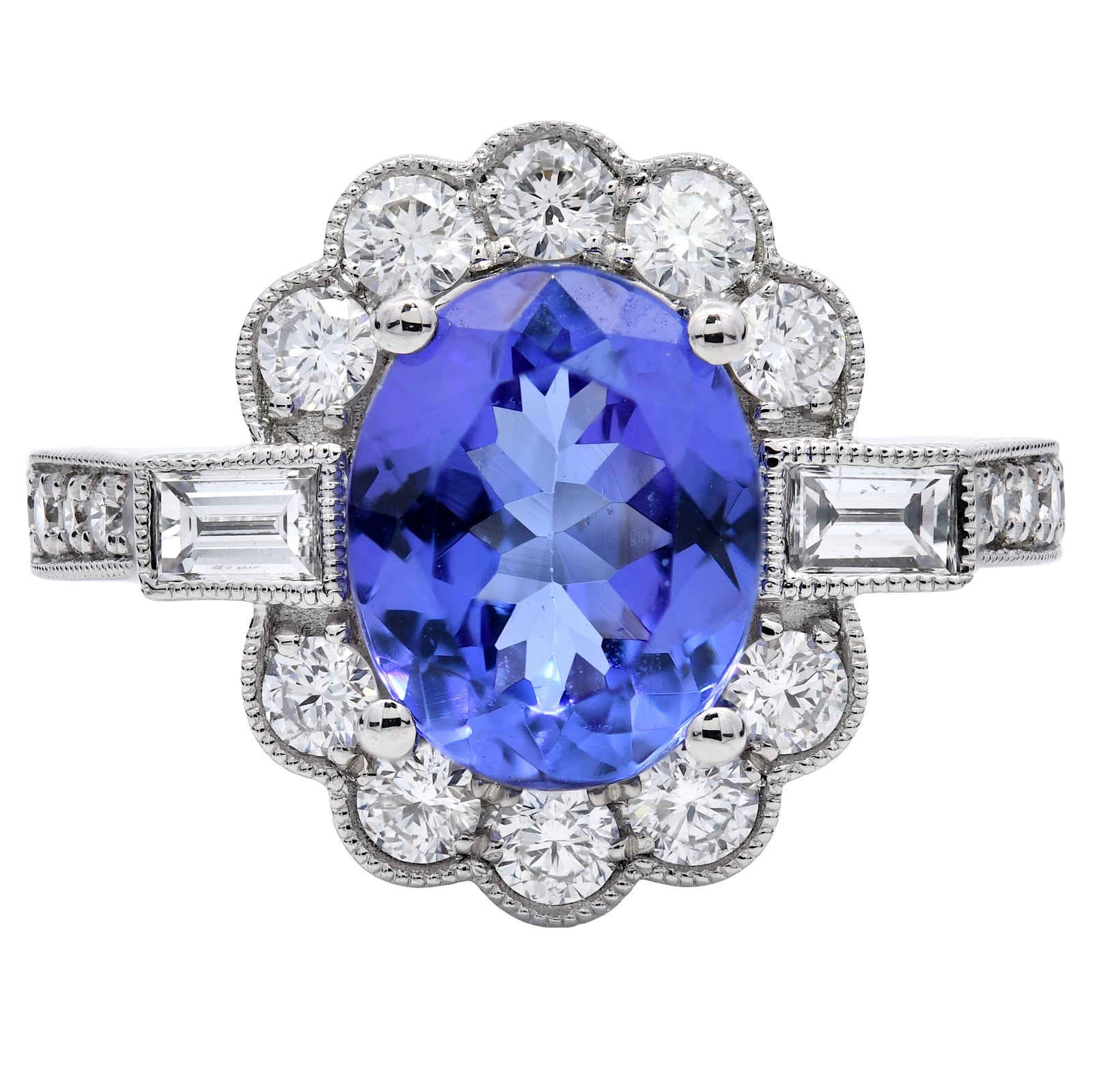 3.00ct tanzanite & diamond ring set in a platinum halo, WGI certified