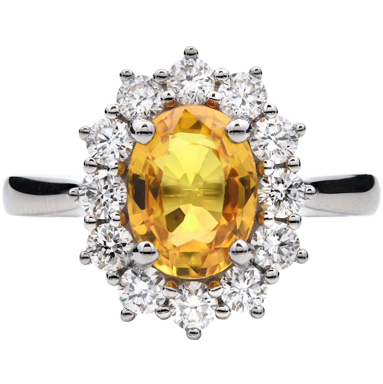 2.32ct yellow sapphire & natural diamond ring, oval cut set in a platinum halo. WGI certified
