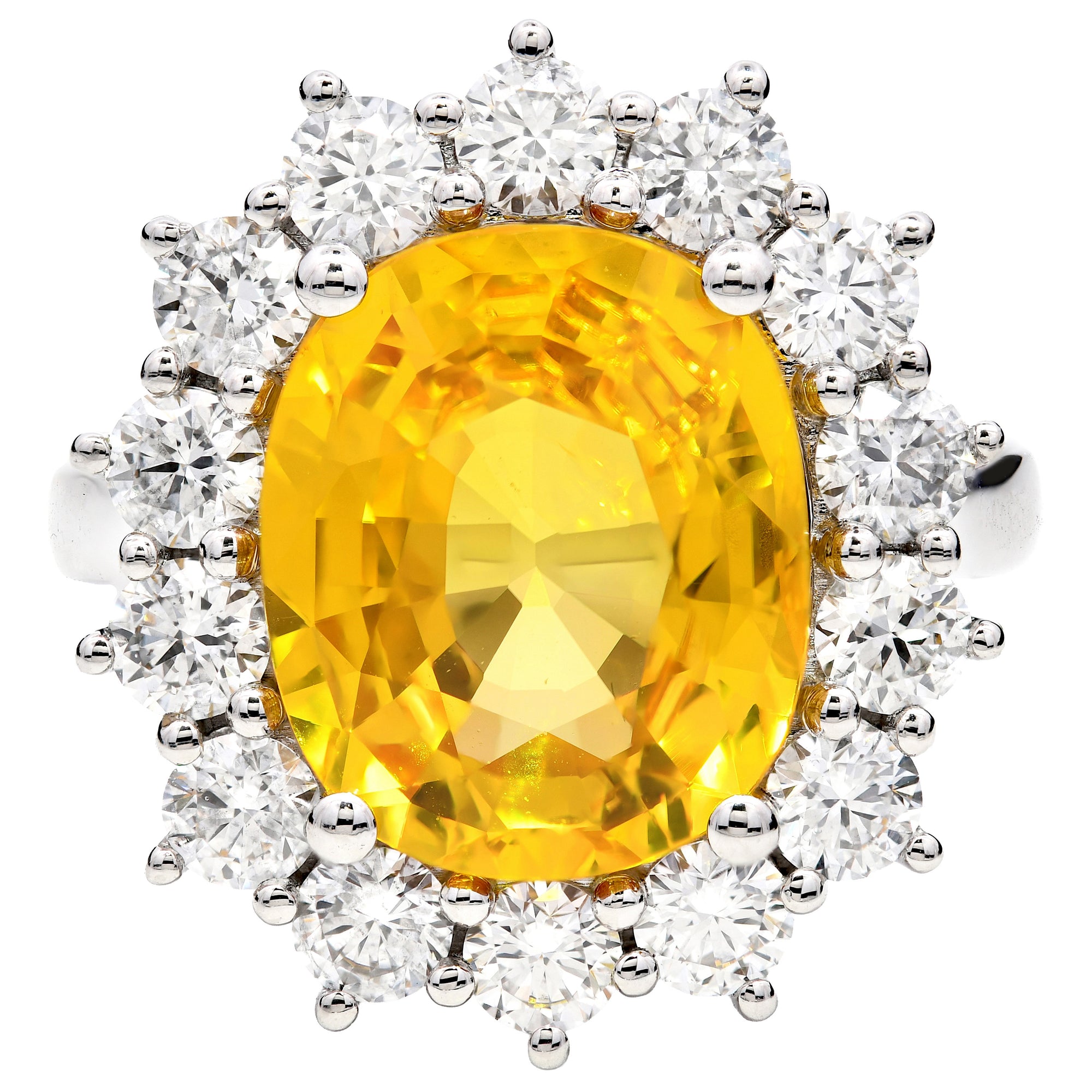 6.90ct yellow sapphire & natural diamond ring set in a platinum halo. WGI certified
