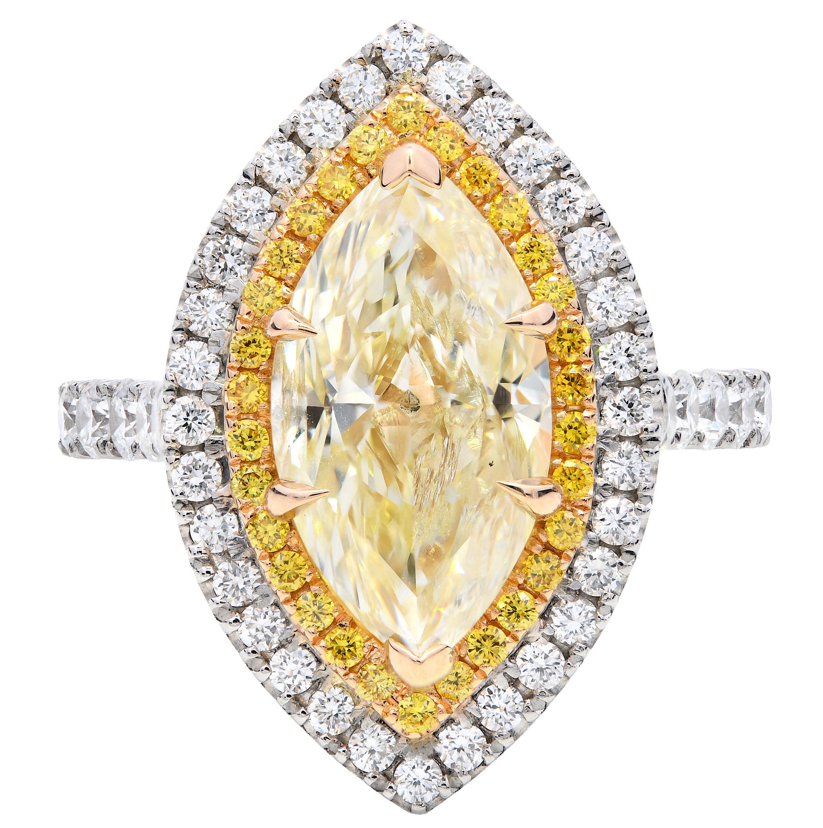 3.22ct natural yellow diamond engagement ring, marquise cut, W-X colour, I2 clarity, GIA certified. Platinum & 18ct Yellow Gold.