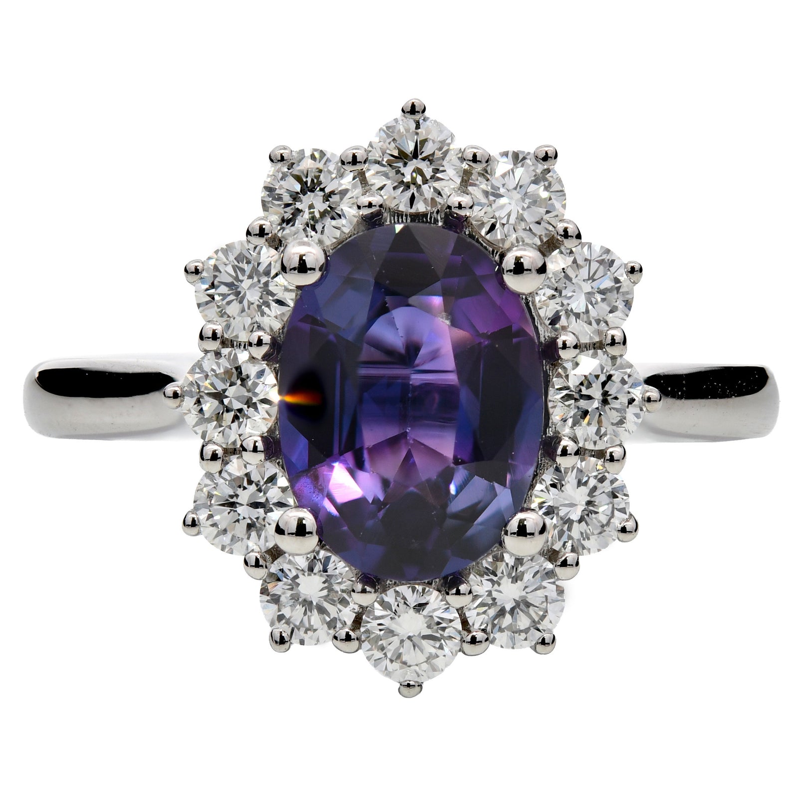 2.42ct purple sapphire & natural diamond engagement ring, oval cut set in a platinum halo. WGI certified