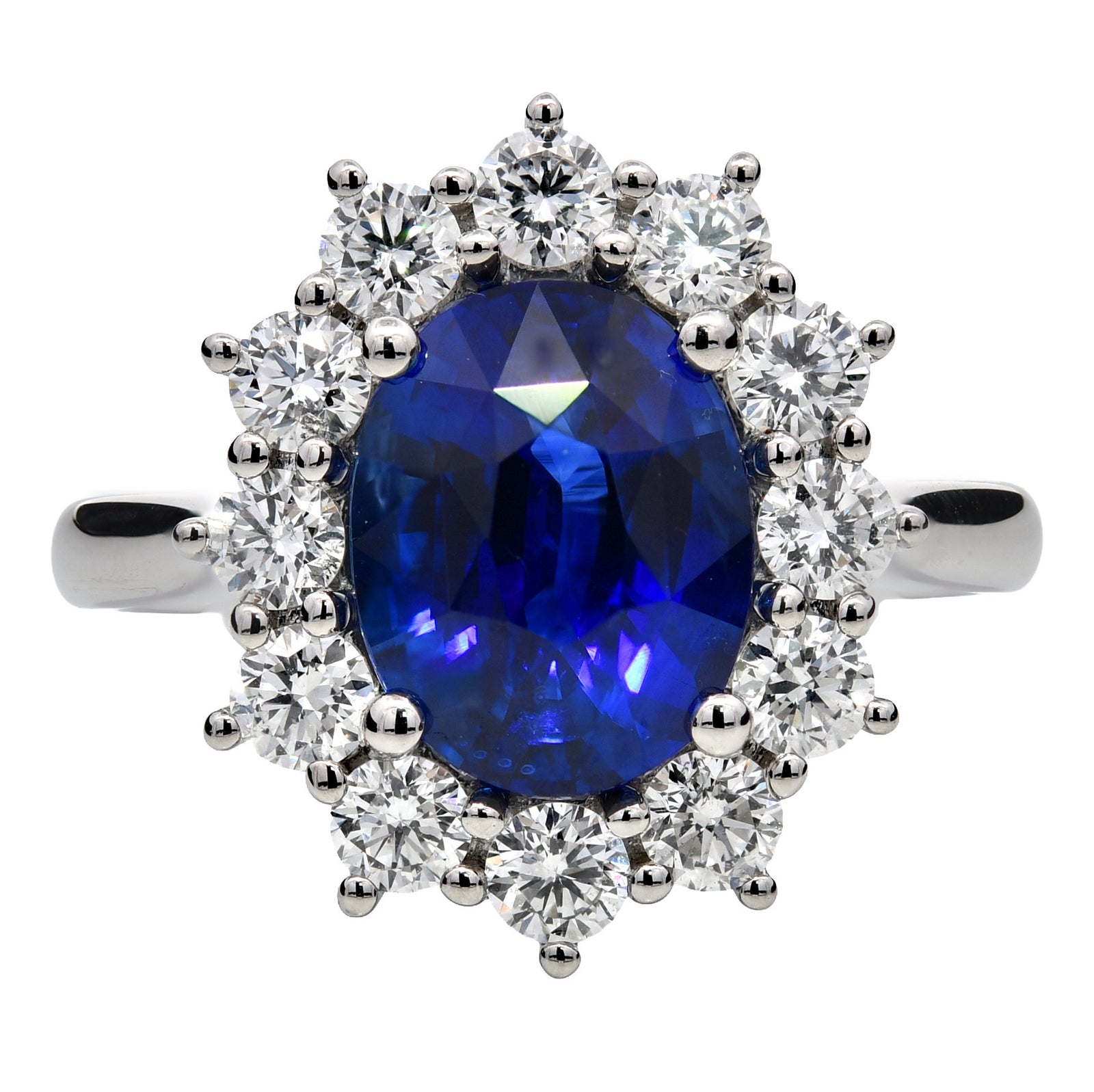 3.93ct blue sapphire & natural diamond engagement ring, oval cut set in a platinum halo. WGI certified