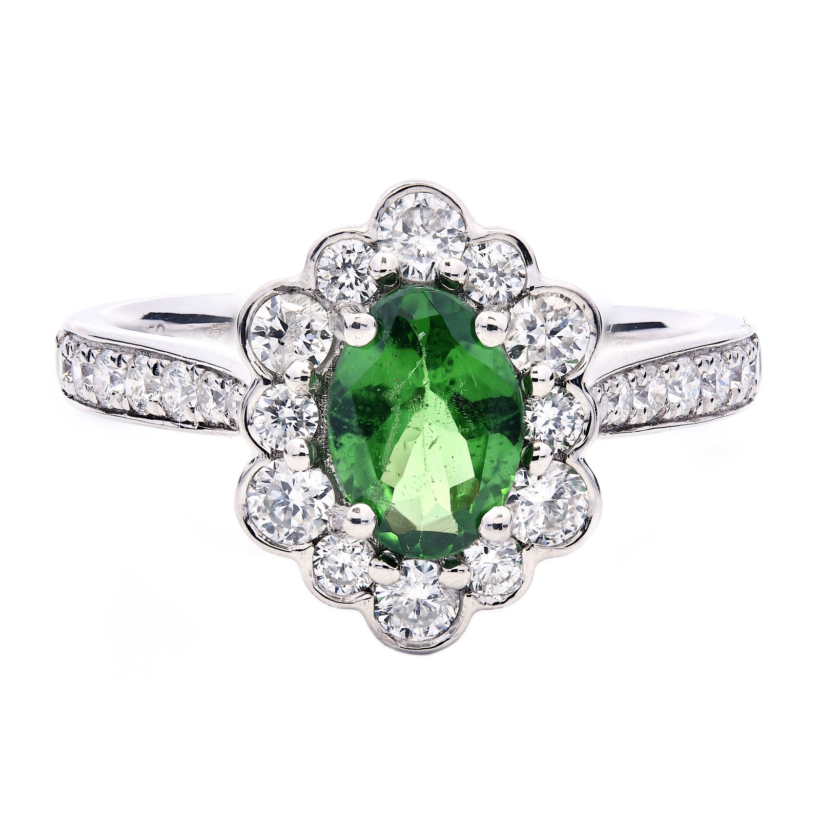 1.33ct oval cut tsavorite & diamond engagement ring set in a platinum halo. WGI Certified
