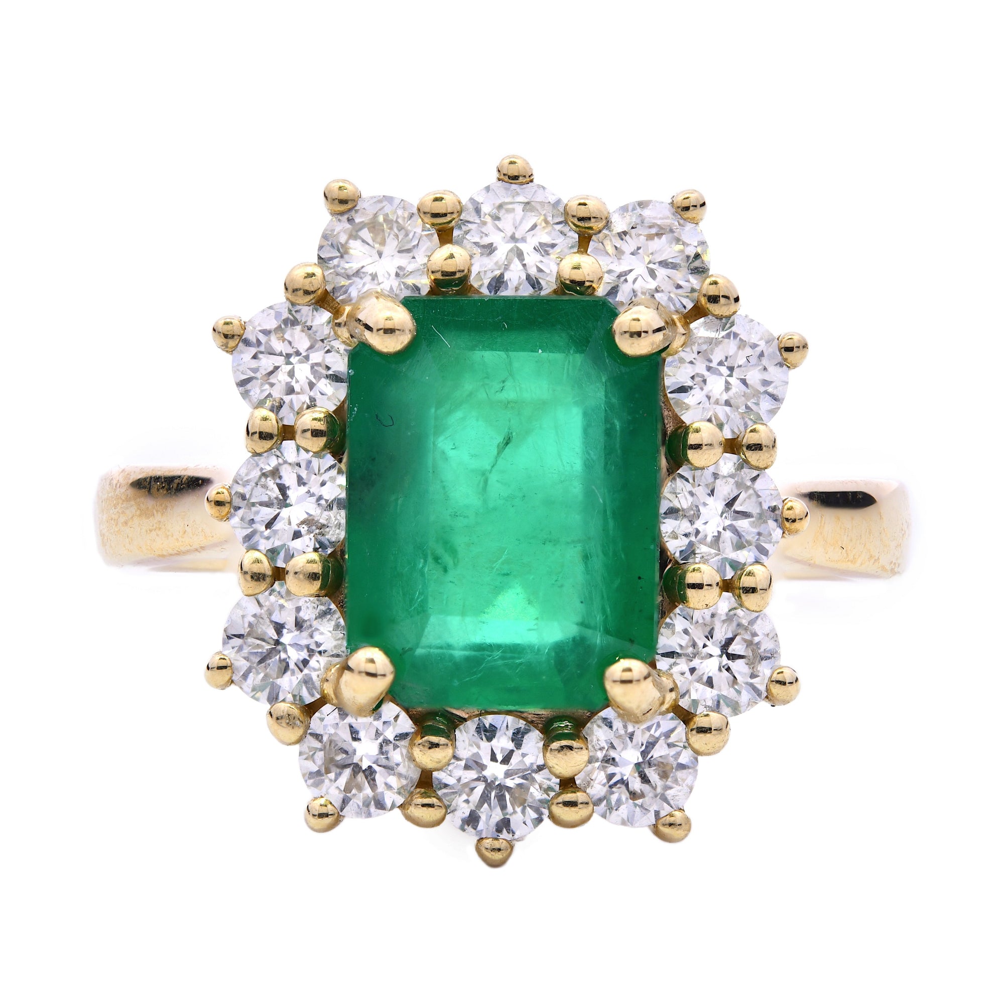 2.91ct emerald & diamond ring set in an 18ct yellow gold diamond halo