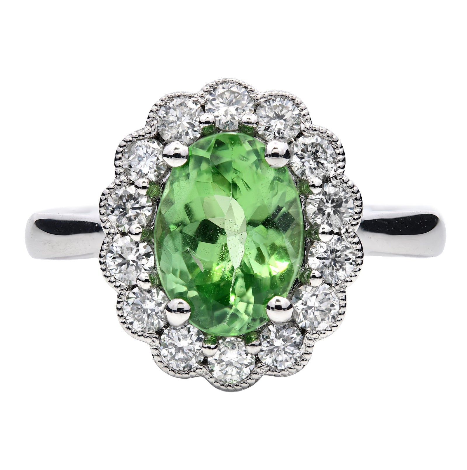 2.02ct oval cut tsavorite & diamond engagement ring set in a platinum halo