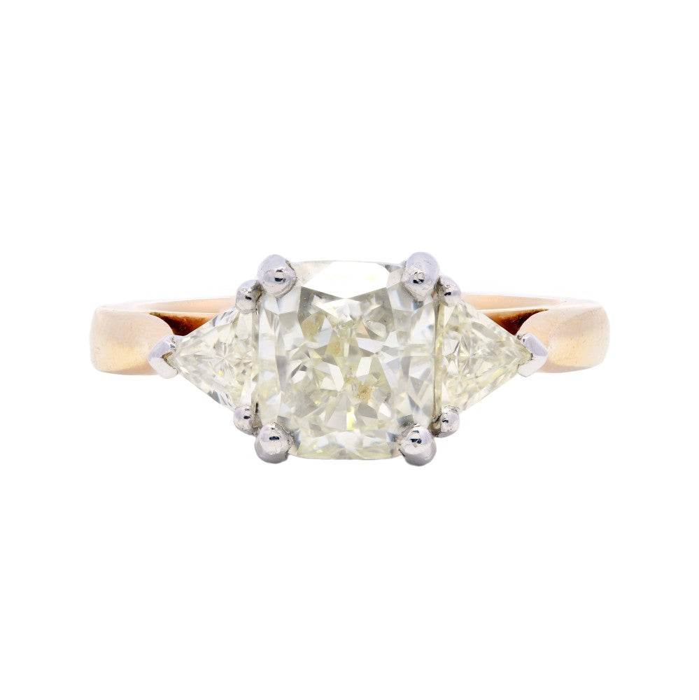 2.39ct cushion cut trilogy ring set in 18ct yellow gold, L, VS1, IGI certified