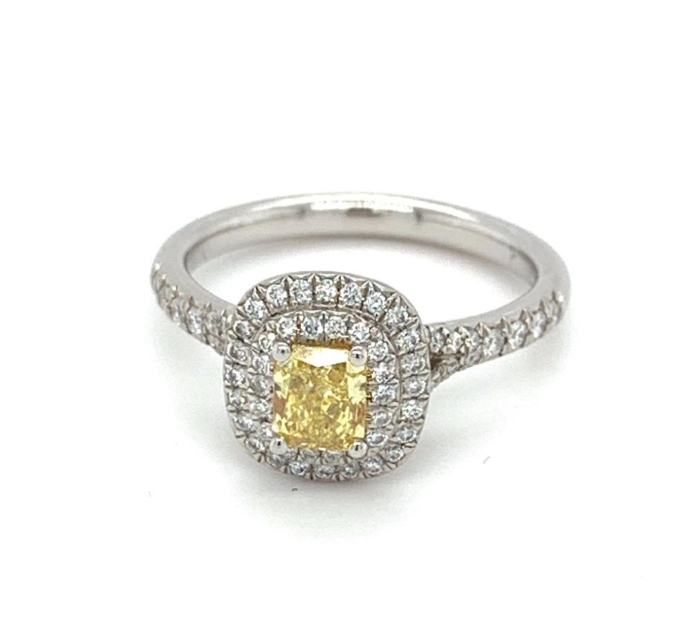 0.90ct radiant cut diamond engagement ring, platinum halo, fancy vivid yellow colour, VS1 clarity, GIA certified
