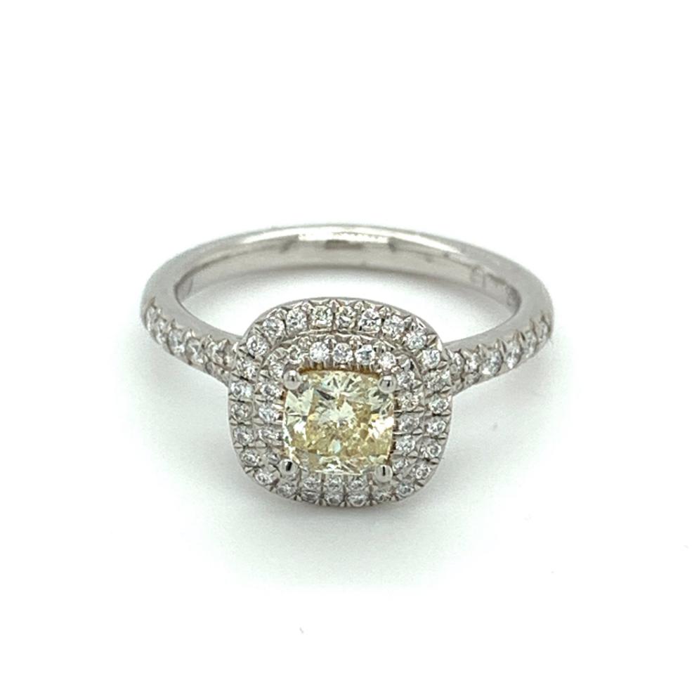 1.00ct fancy yellow diamond engagement ring set in a platinum halo, I1 clarity, GIA certified