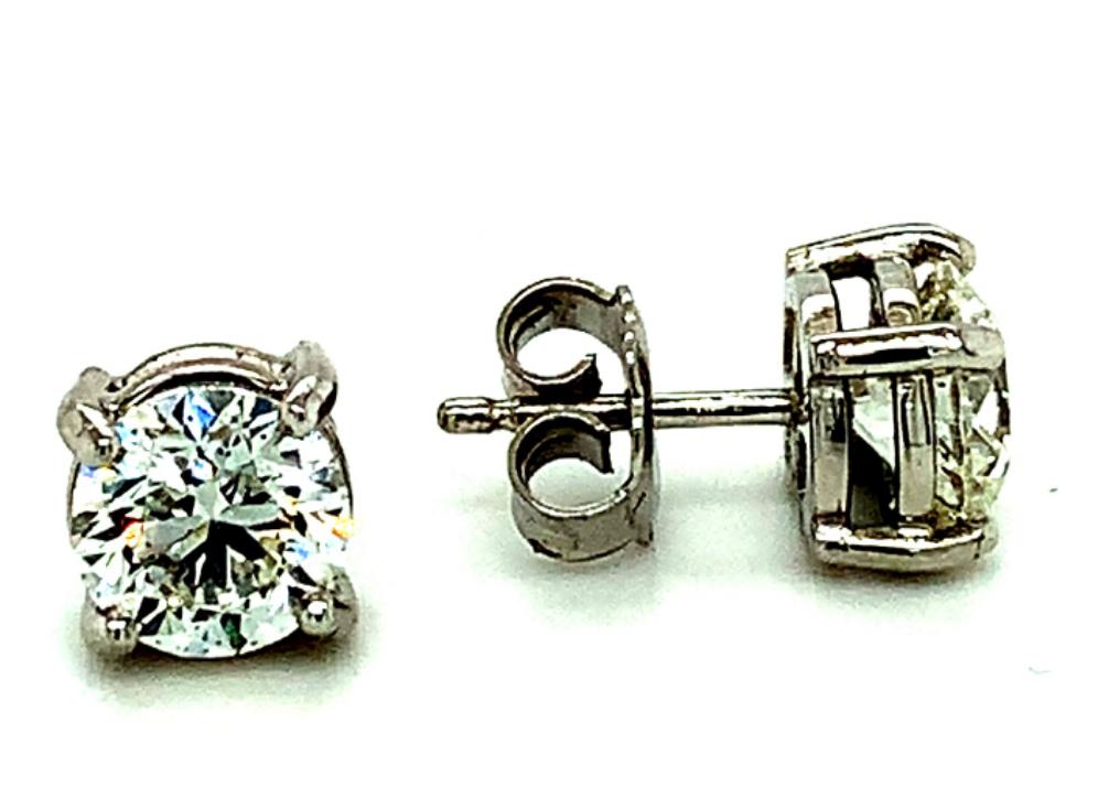 2.93ct round brilliant diamond stud earrings set in 18kt white gold, J/M colour, SI clarity