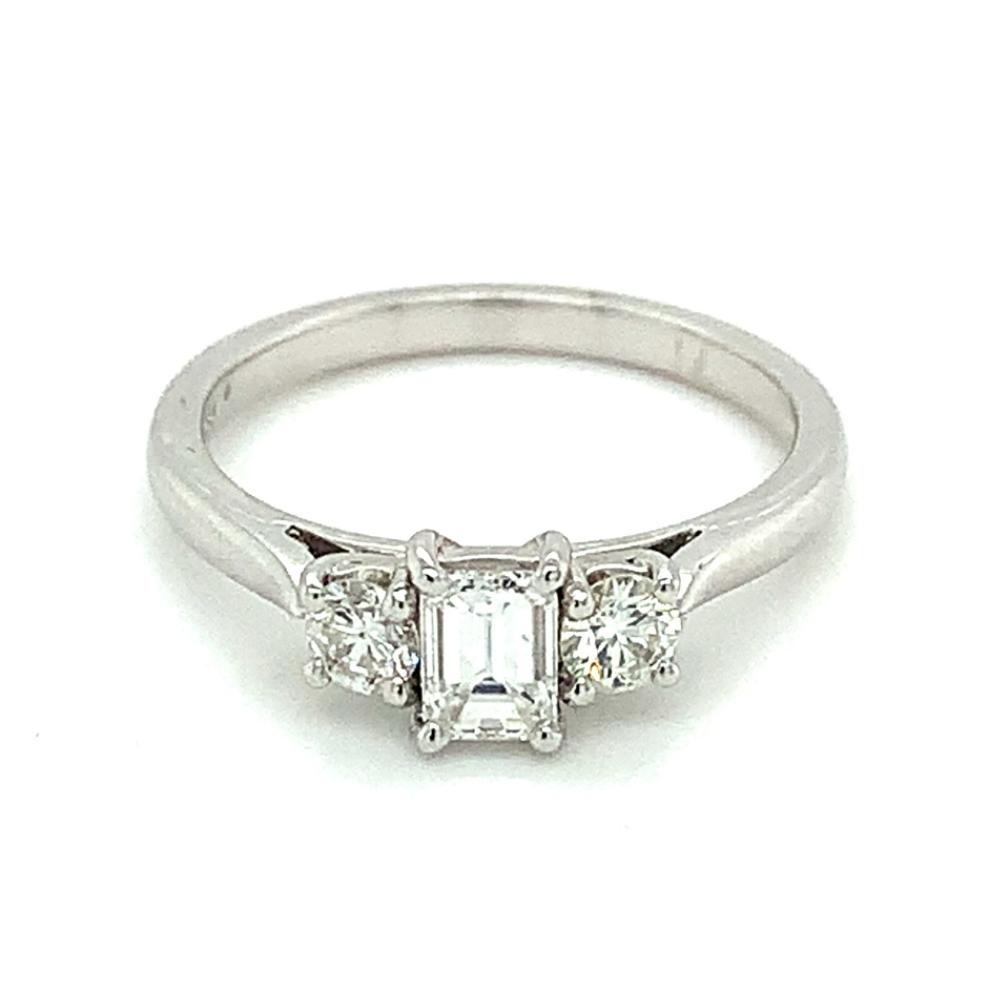 0.71ct emerald & round brilliant diamond trilogy engagement ring, 18kt white gold, G/H colour, SI clarity