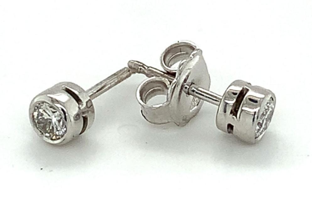 0.40ct diamond rubover stud earrings set in 18kt white gold