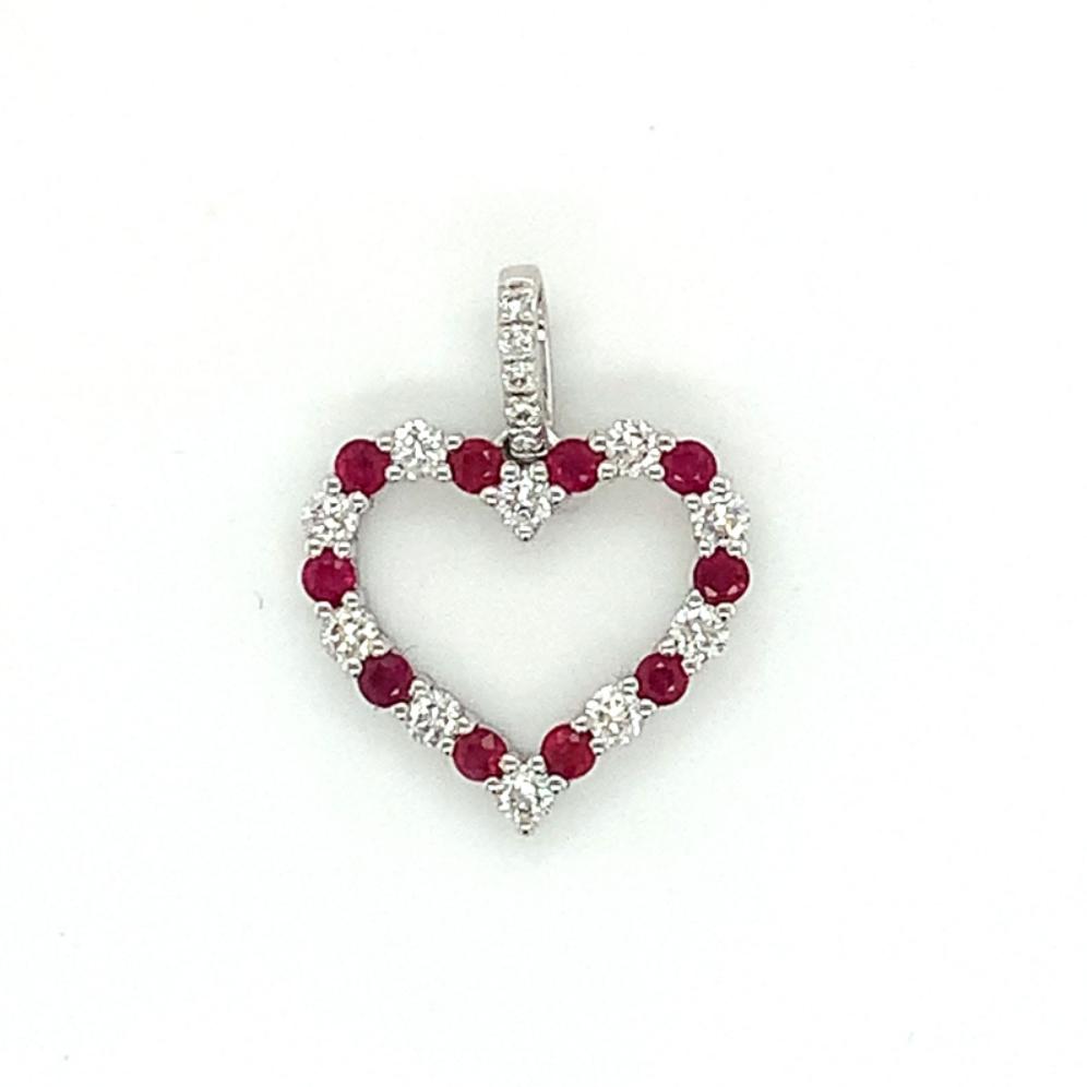 0.63ct ruby & diamond heart shaped pendant set in 18kt white gold, G/H colour, SI clarity