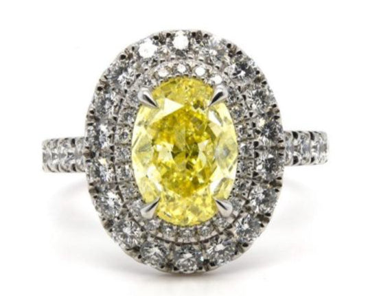 3.30ct fancy intense yellow oval diamond, I2 clarity, platinum halo, GIA certified