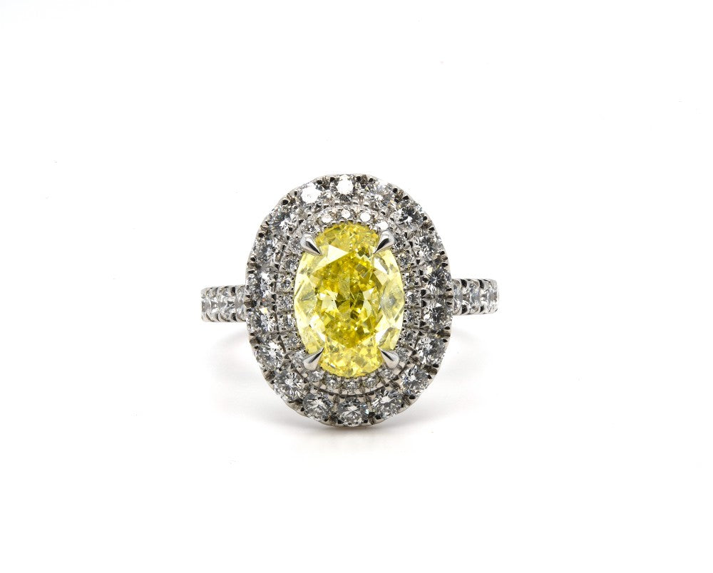 3.30ct fancy intense yellow oval diamond, I2 clarity, platinum halo, GIA certified