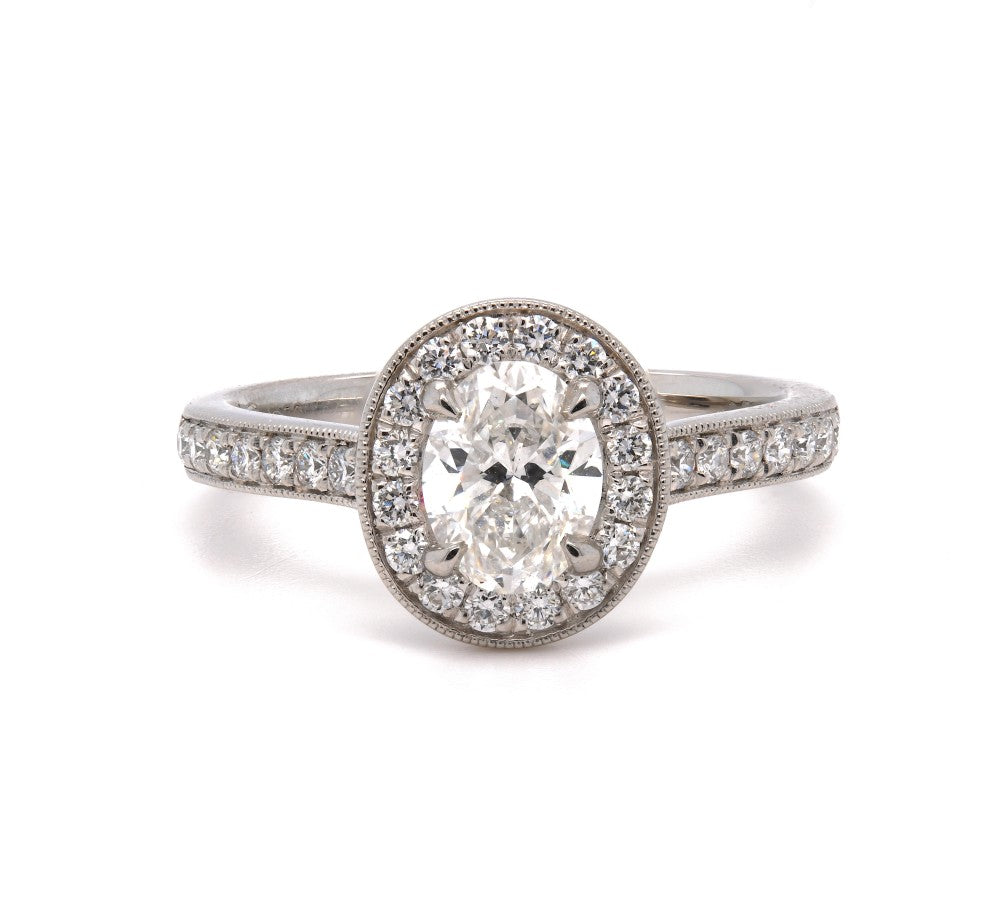 0.99ct oval cut diamond engagement ring set in a platinum halo, F, SI2, GIA certified