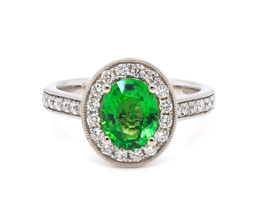 1.63ct oval cut tsavorite & diamond engagement ring set in a platinum halo