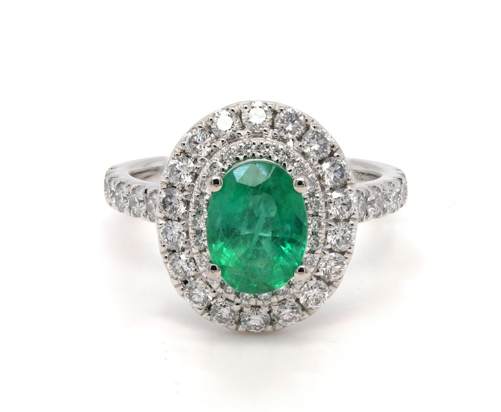 2.18ct emerald & diamond ring set in a double platinum halo