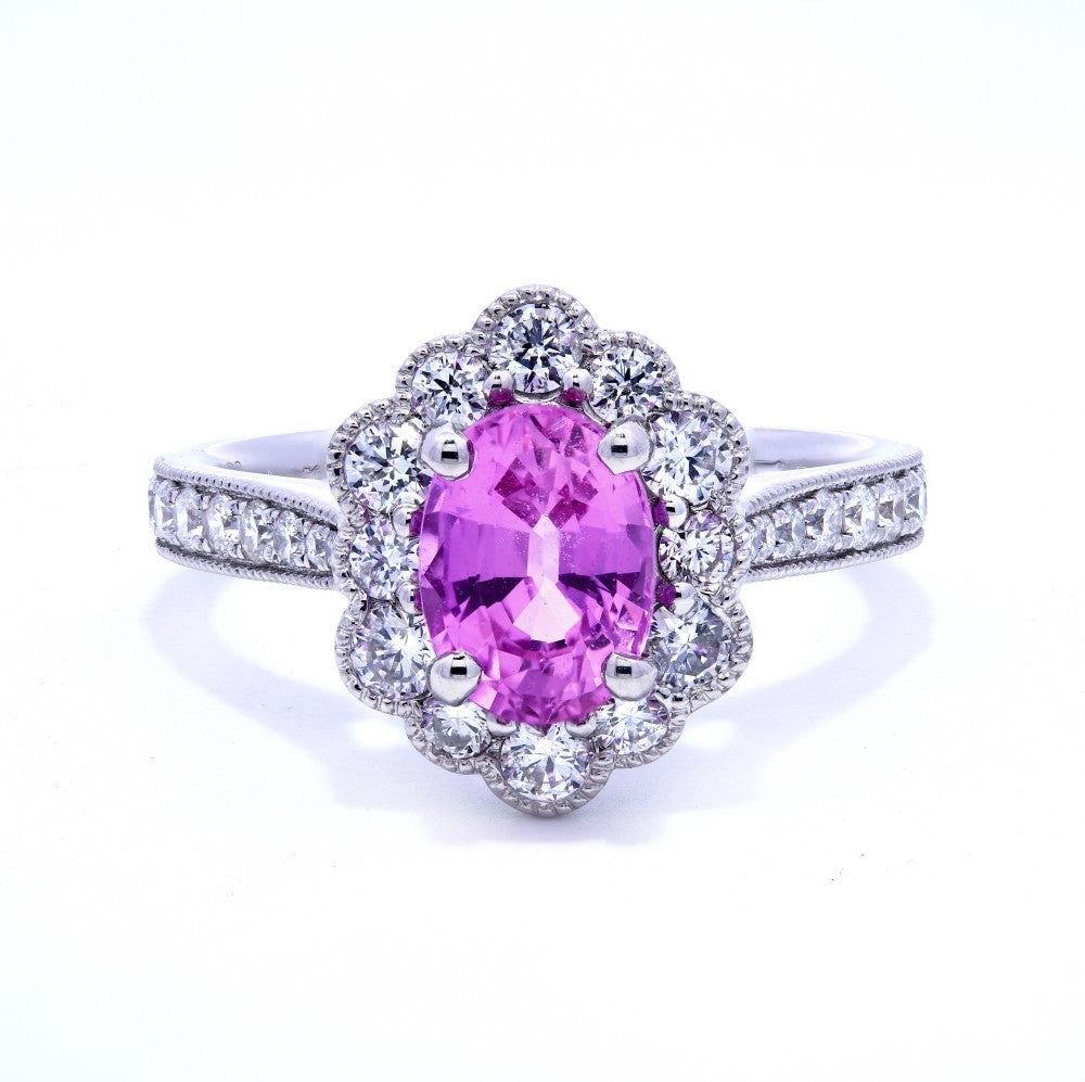 2.05ct oval cut pink sapphire & diamond engagement ring set in a platinum halo