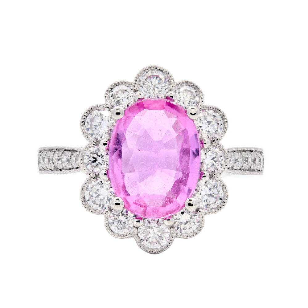 2.92ct oval cut pink sapphire & diamond engagement ring set in a platinum halo