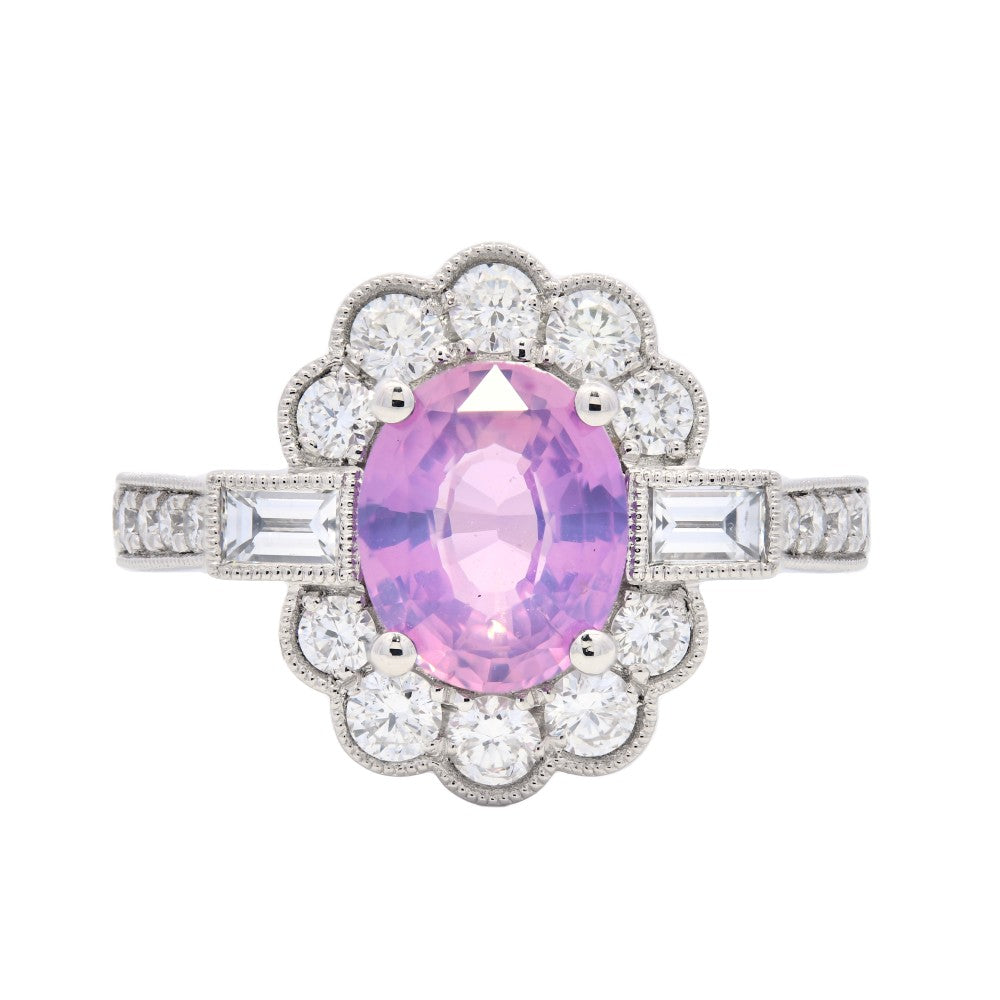 2.29ct oval cut pink sapphire & diamond engagement ring set in a platinum halo
